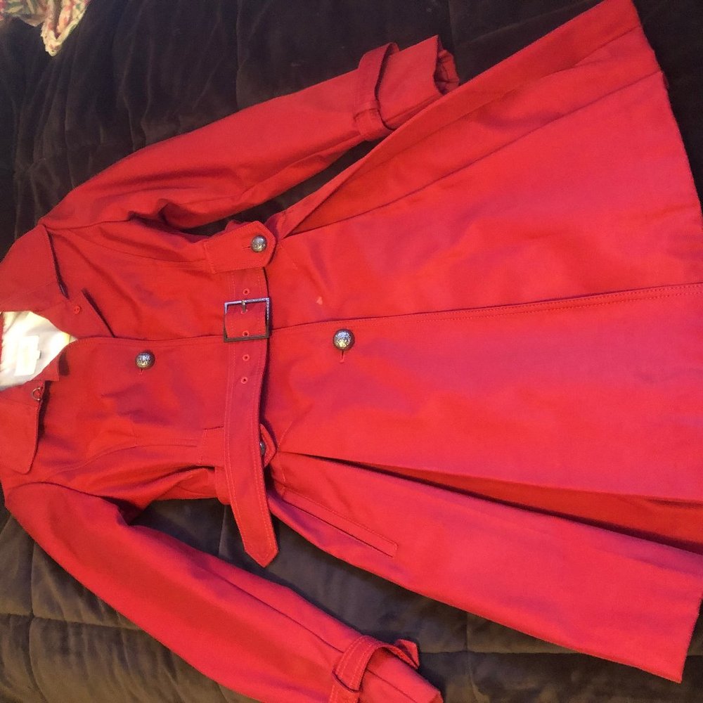 Beautiful red spring raincoat